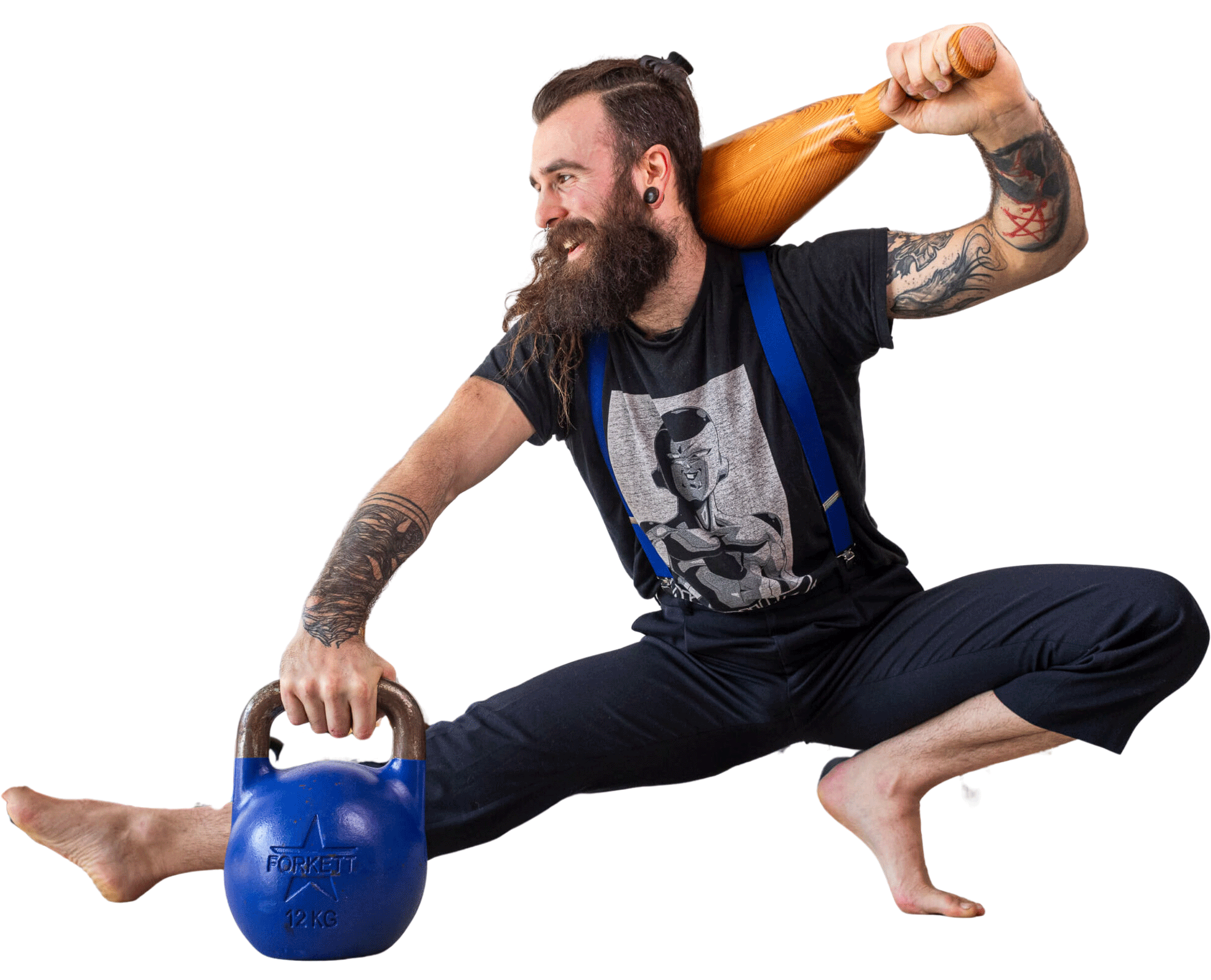 Un pratiquant en pleine séance mêlant kettlebell et massue au studio