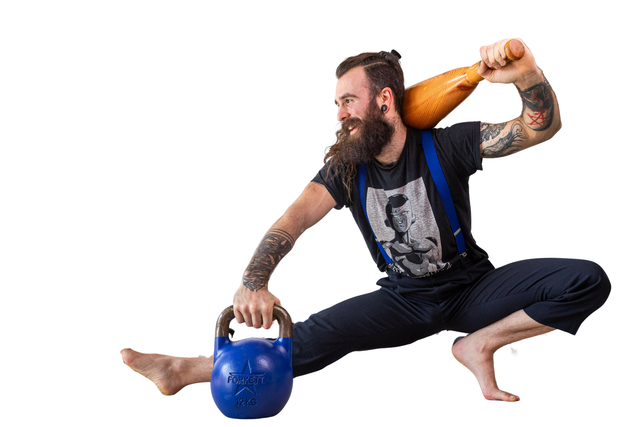 Un pratiquant en pleine séance mêlant kettlebell et massue au studio